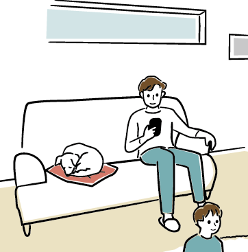 ソファに座る男性と犬